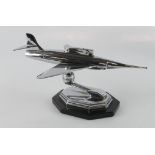 Novelty table lighter depicting a jet aircraft, mounted on an octagonal base, total height 13cm,