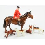 Beswick. A Beswick Huntsman, two hounds & two foxes, Huntsman height 21cm approx.