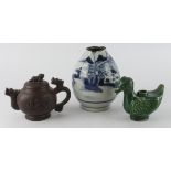 A Chinese red/purple clay Yixing style teapot with a dragon head spout and handle and a lion