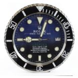 Advertising Wall Clock. Black 'Rolex' style advertising wall clock, black & blue dial reads 'Rolex