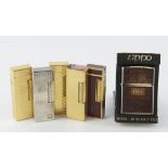 Dunhill. Five various Dunhill lighters, together with a cased Zippo lighter