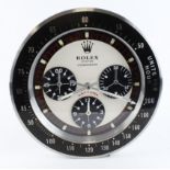 Advertising Wall Clock. Black 'Rolex' style advertising wall clock (Daytona) with a white dial,