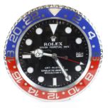 Advertising Wall Clock. Red & blue (Pepsi) 'Rolex' style advertising wall clock, black dial reads '