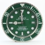 Advertising wall clock. 'Green Rolex' style wall clock. Approx diameter 34cm