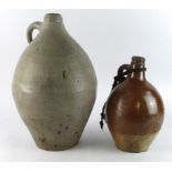 Bellarmine jars (2). The first, brown salt-glazed with rope handle still attached. Measures approx