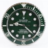 Advertising Wall Clock. Green 'Rolex' style advertising wall clock, black dial reads 'Rolex Oyster