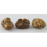 Netsukes. Three carved wood Netsukes, comprising two dogs, two mice & a rabbit, largest length