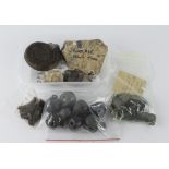 Antiquities etc (24): 8 crotal bells intact, 2 bronze weights, 5 thimbles, Stone Age flint hand