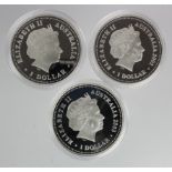 Australia (3) silver proof Dollars 2002-2003 in capsules.