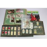Small tray of various old cigarette cards and postcards loose in albums, noted Prices Patent