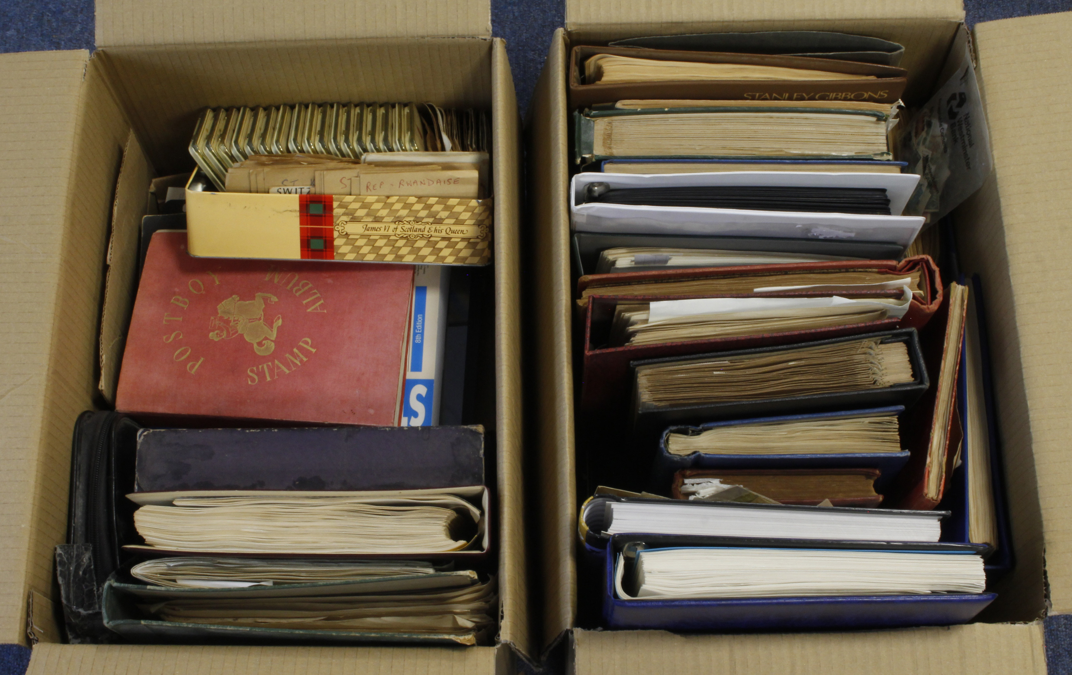 World mix in large boxes, housed in several albums / stockbooks / binders. One Country albums