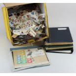 Large yellow box with world material in a few albums, rest of box on paper world kiloware.. (Buyer