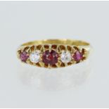 18ct yellow gold antique diamond and ruby ring, three graduating rubys principal measures 4mm, two