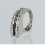 White gold (tests 18ct) contemporary diamond ring, two rows of round brilliant cuts TDW approx. 0.