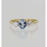 Yellow gold (tests 18ct) vintage diamond and aquamarine trilogy ring, one oval sky blue aquamarine