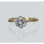 Yellow gold (tests 18ct) vintage diamond daisy cluster ring, set with seven old cut diamonds TDW