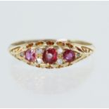 18ct yellow gold Edwardian ring, set with four rose cut diamonds, two rubies and a central ruby
