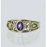 9ct yellow gold contemporary suffragette ring, set with one oval amethyst and two pear shaped