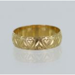 18ct yellow gold ring, hand engraved with hearts, 5mm wide, finger size M/N, weight 2.7g.