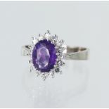 18ct white gold diamond and amethyst cluster ring, oval amethyst measures approx. 9mm x 7mm,