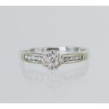 18ct white gold diamond cluster ring, seven round brilliant cut diamonds in the cluster with diamond
