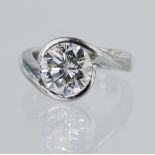 White gold (tests 18ct) diamond solitaire ring, certificated round brilliant cut 3.02ct, colour L,