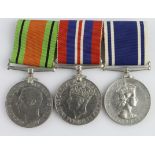 Group mounted as worn - Defence & War Medals, QE2 Police LS Medal (Sergt William G. Saunders). (3)