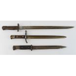 Bayonets x3 all without scabbards. 1) P'07 by Wilkinson dated March 1918. 2) Italian Carcano,