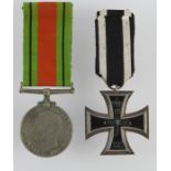 German WW1 Iron Cross 2nd Class with a WW2 Defence Medal named NX35487 R J Waters. (2)