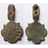 Artefact: Medieval bronze horse pendant 22x40mm, lion l. within decorative border, trace enamel,