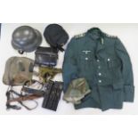 German WW2 equipment including helmet with cover, soldiers service jacket, leather pouches,