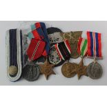 German 3rd Reich medals, cloth badges, eppulette, etc. And three Britis WW2 medals (10 items)