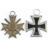 German WW2 Iron Cross 2nd Class maker marked '4' to ring, and a War Merit Cross with Swords. (2)
