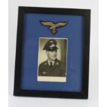 German framed photo of a Luftwaffe air man with breast eagle above.