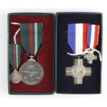 General Service Cross and Voluntary Service Medal, both hallmarked silver, unnamed in boxes of