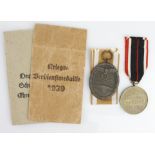 German WW2 West wall medal and War merit medal both in packets of issue.