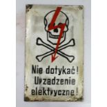 German Camp interest a warning of electric fence. Polish ?