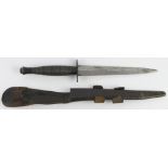 Commando dagger housed in its leather and metal tipped scabbard. Marked 'William Rodgers Sheffield