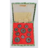 China, early to mid-20thC boxed set of 10x Cash coins with an old certificate in fragments.