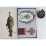 Royal Flying Corps officers bronze cap badge, an officers postcard, and a Leefe Robinson VC