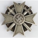 German War Merit Cross with Swords, star burst screw back fitting.