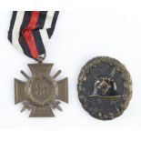 German Cross of Honour with wound badge in black both with award documents to Jakob Strobel.