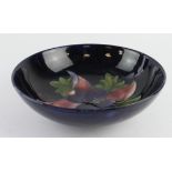 Moorcroft Pottery Clematis pattern fruit bowl, makers label and marks to base, diameter 24cm