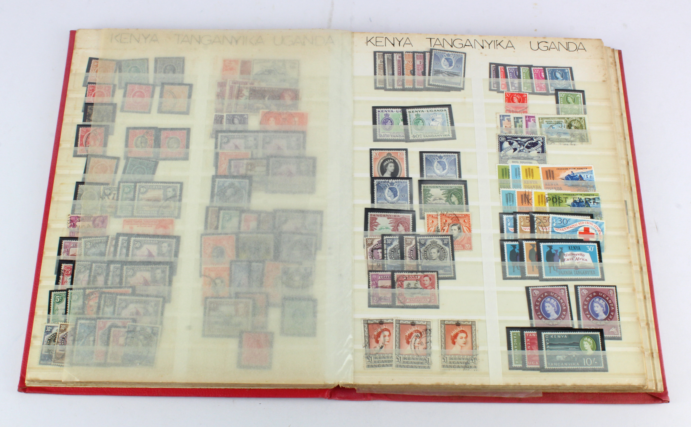 Red stockbook with many British Commonwealth, QV to early QE2 um / m / used, in sets, part sets