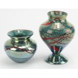 Pair of the red trailed metallic blue lustre vases. The first a small bulbous shape with flared rim.