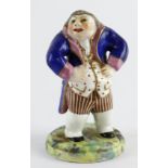 Crown Derby figure, depucting a short plump gentleman wearing a blue & pink coat, circa 1780 - 1800,