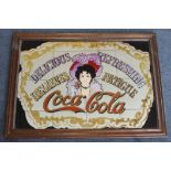 Coca Cola advertising mirror in a wooden frame, total size 91cm x 66cm approx.