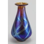 Carin Von Drehle. Iridescent blue trailed bud vase, signed along base edge. Made during her time