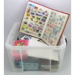 Large clear plastic crate with a varied range of World material, loose in packets and several