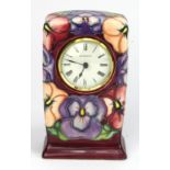 Moorcroft Pottery Pansey pattern mantel clock, makers marks to base, height 15.5cm approx.